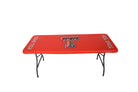 Red Texas Tech University table cover featuring the Double T logo in the center and “TEXAS TECH” text on each end, fitted over a standard folding table.