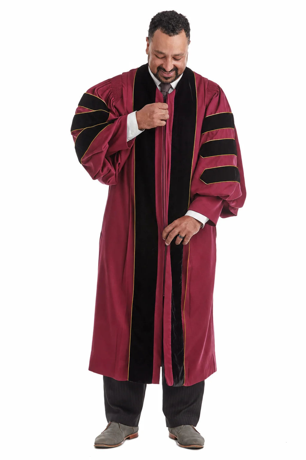 Maroon doctoral gown with black velvet panels and gold piping