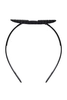 Black CAPGOWN CapStay headband against a white background