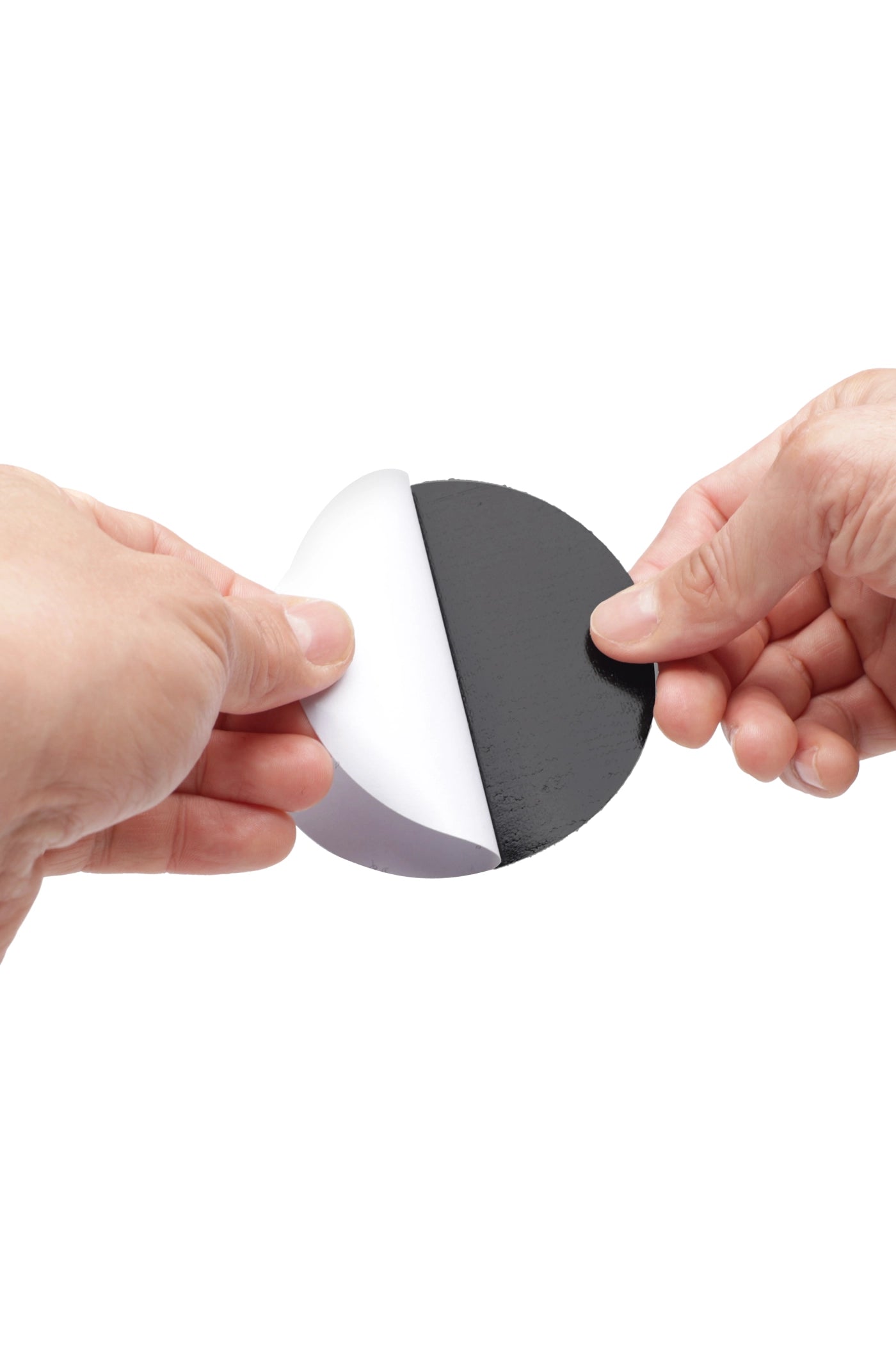 Two hands removing the adhesive from the top of the CAPGOWN capstay headband against a white background