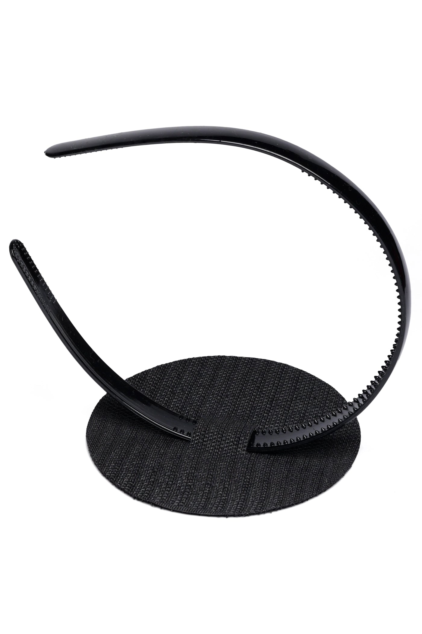The CAPGOWN CapStay flipped to show how to put the headband in against white background