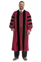 Maroon doctoral gown with black velvet panels and gold piping