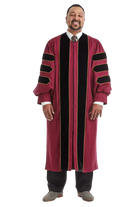 Maroon doctoral gown with black velvet panels and gold piping
