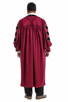 Maroon doctoral gown with black velvet panels and gold piping