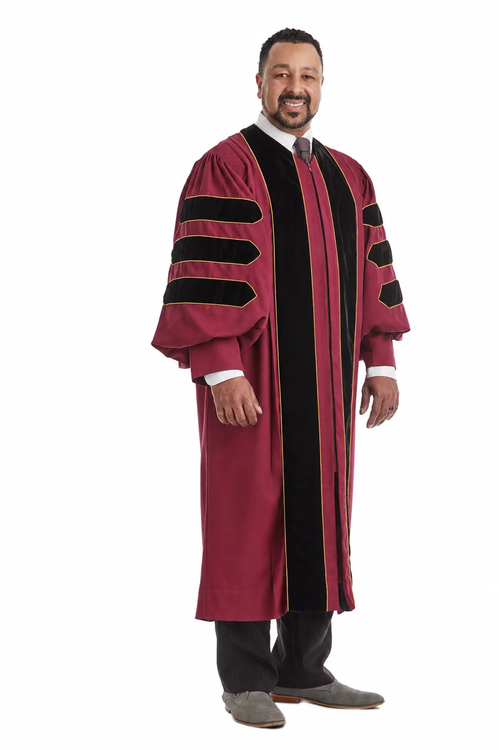 Maroon doctoral gown with black velvet panels and gold piping