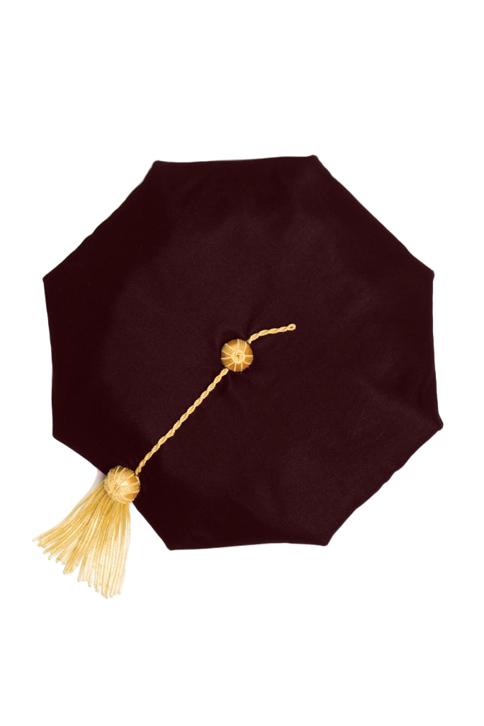 UT Austin brown eight-sided doctoral tam with gold bullion tassel, crafted in plush velvet for distinguished academic tradition.