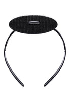 The CAPGOWN CapStay headband with velcro and plastic band against a white background