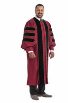 Maroon doctoral gown with black velvet panels and gold piping